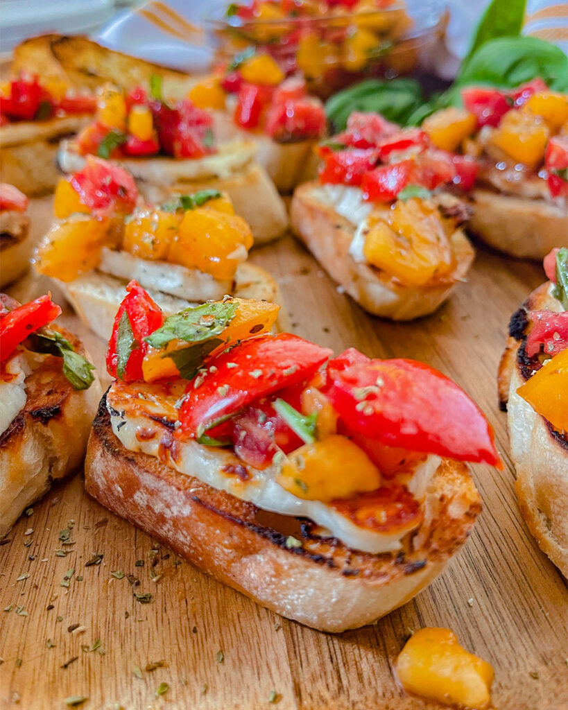 Bread and halloumi cheese topped with tomatoes, oregano and basil