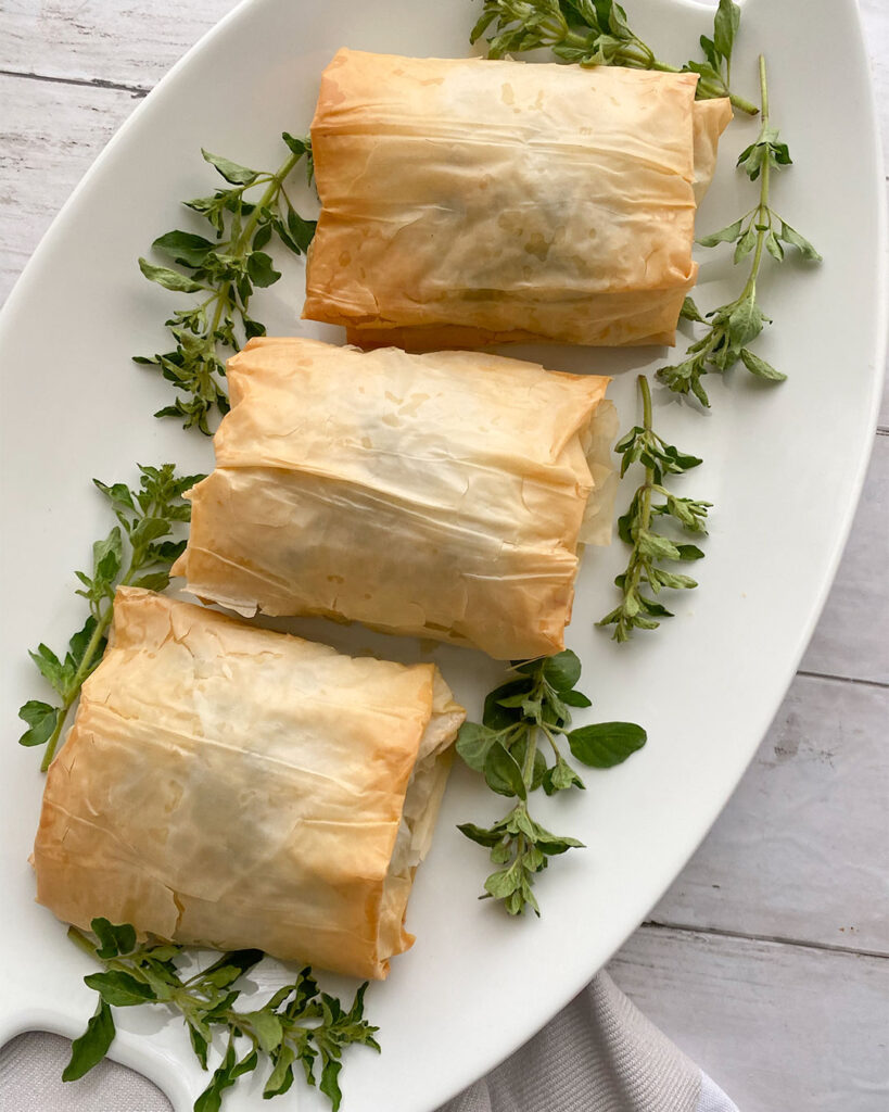 Chicken and spinach wrapped in layers of phyllo dough and baked to perfection