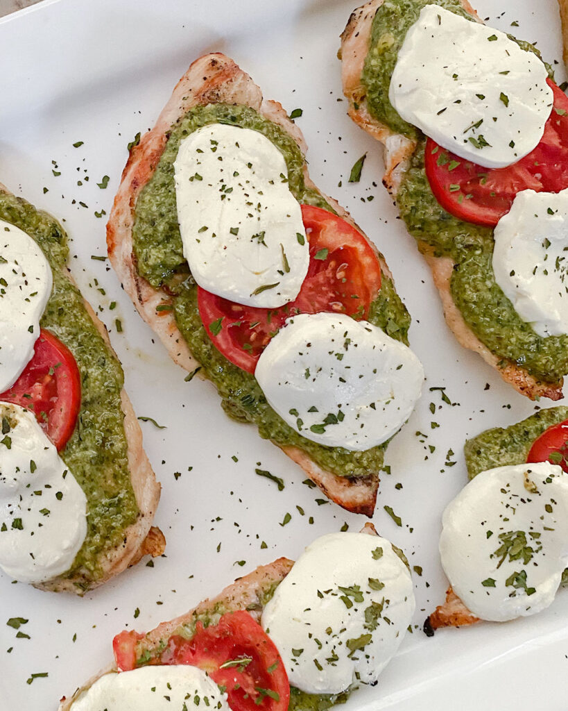 Grilled chicken with homemade pesto, tomatoes and mozzarella cheese