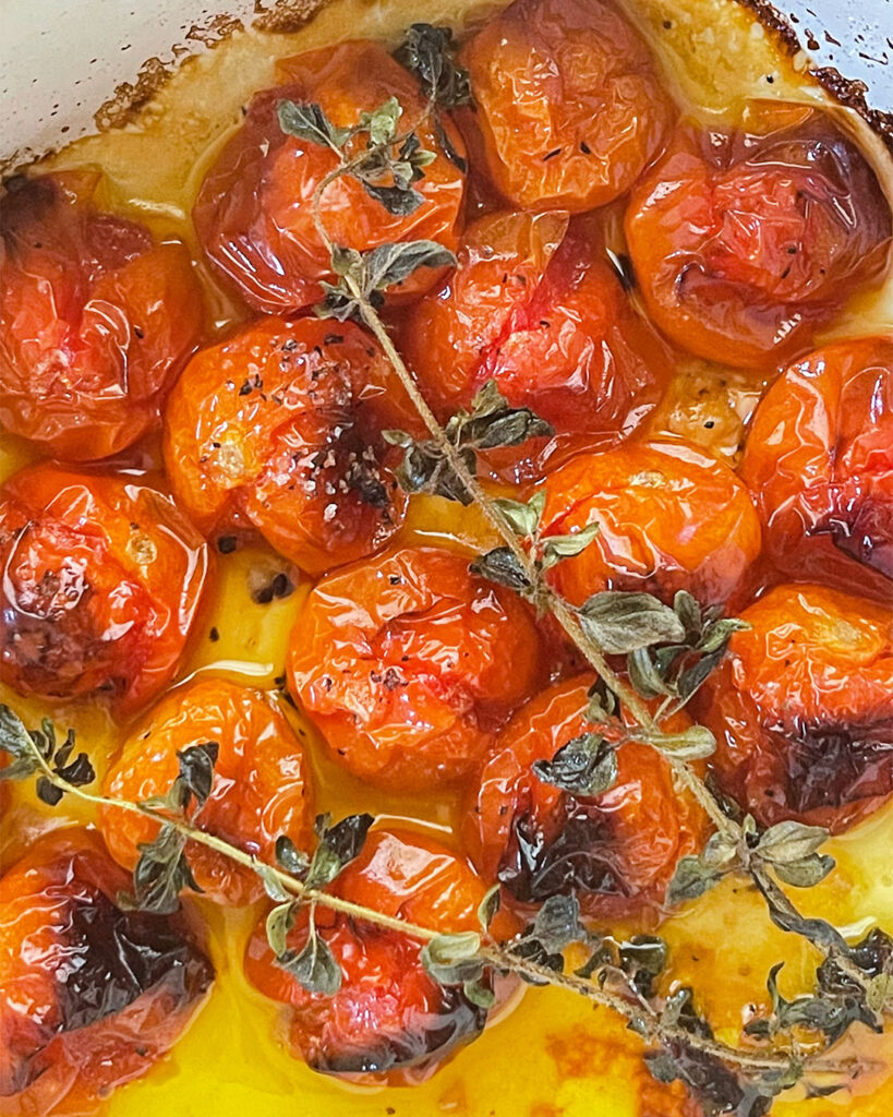 Roasted tomatoes in olive oil with herbs