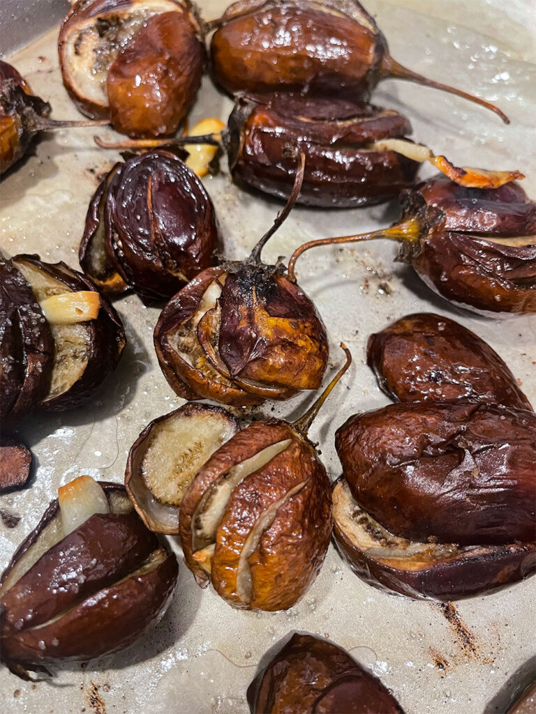 Cooked eggplant on a baking sheet