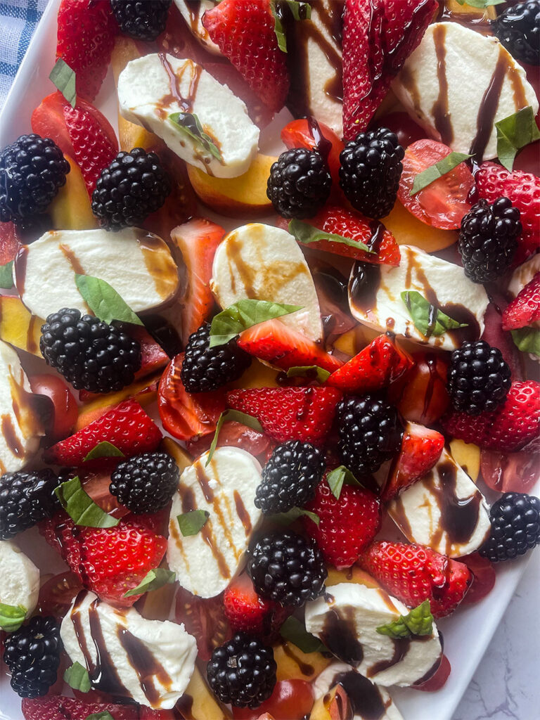 Strawberries, peaches, blackberries, topped with fresh basil and drizzled with a balsamic glaze.