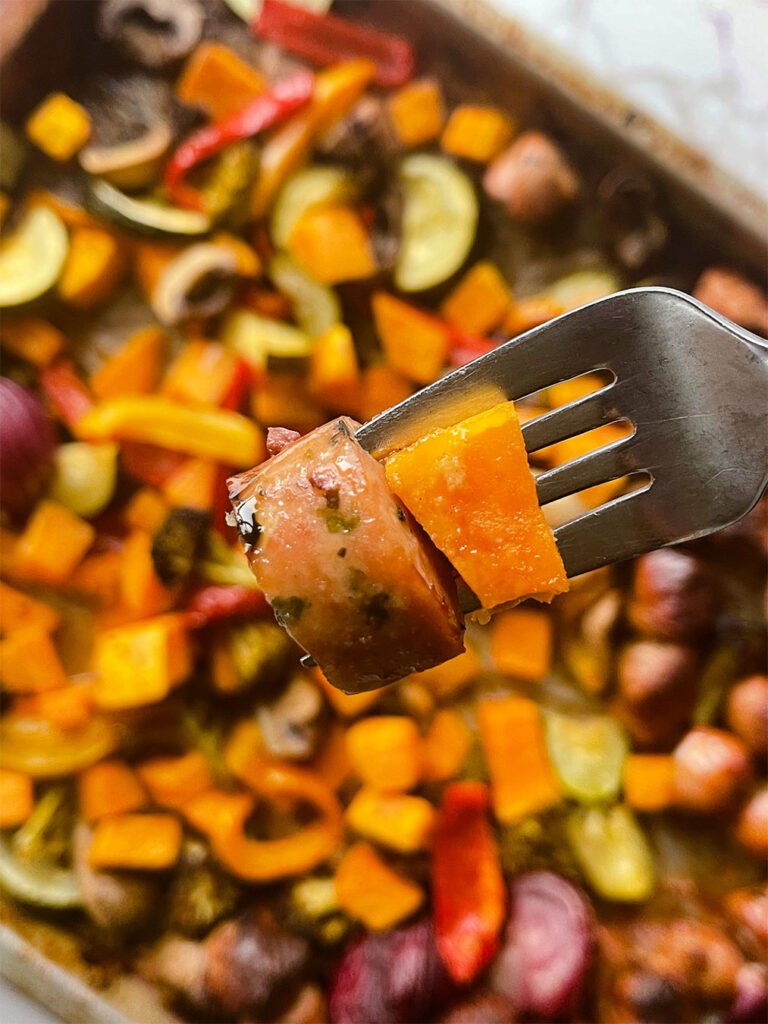 Fork with a piece of sausage and vegetble